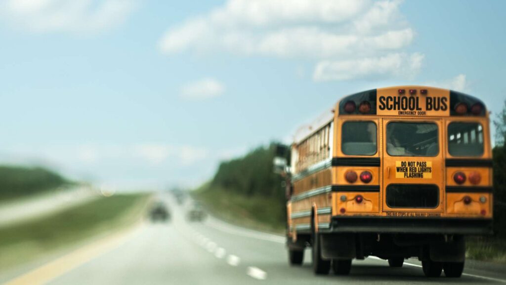 A school bus traveling down a highway