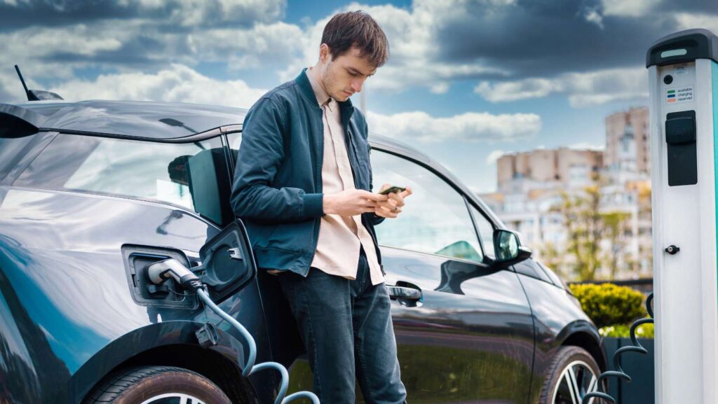 Man Charging Electric Car