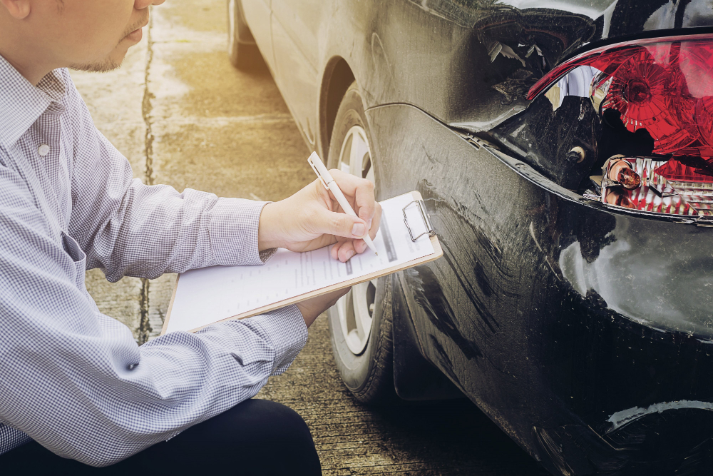 Insurance agent working on car accident claim process