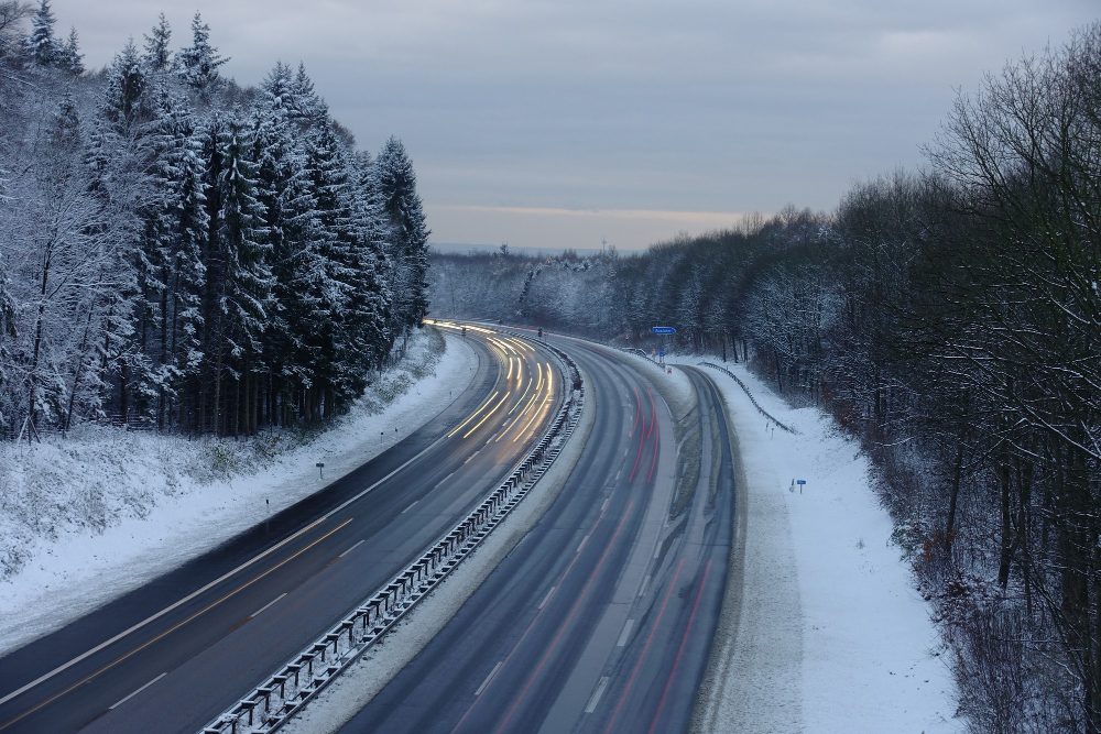 Snowy motorway at dusk in germany